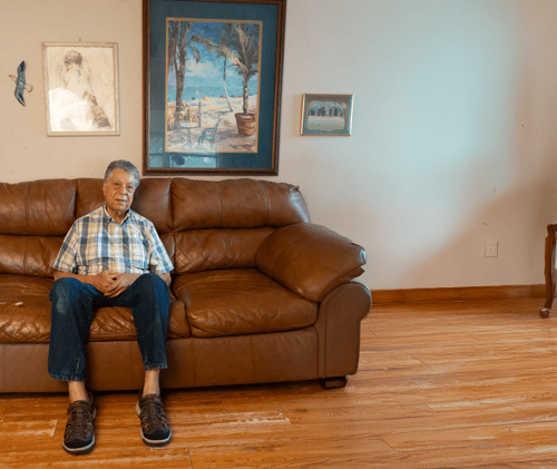 Julio sitting on couch
